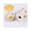 Salt & Pepper Set - features bees buzzing over flowers with yellow accents. Shakers include unique openings to tell them apart, with plastic stoppers for easy refilling & cleaning