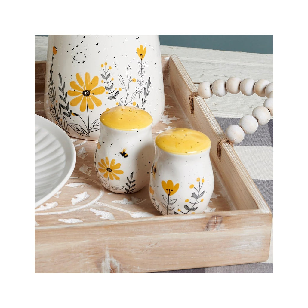 Salt & Pepper Set - features bees buzzing over flowers with yellow accents. Shakers include unique openings to tell them apart, with plastic stoppers for easy refilling & cleaning